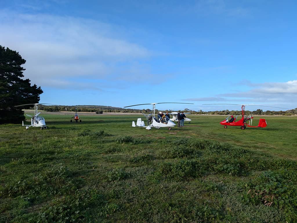 Gyrocopters parked on the grass