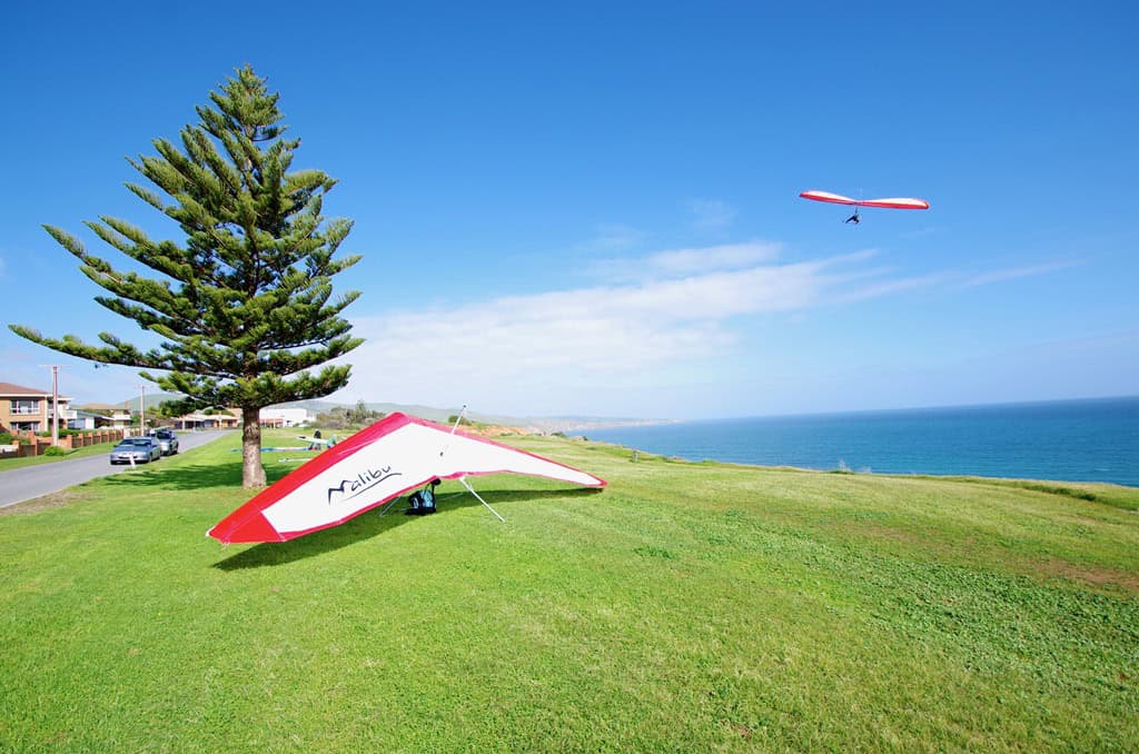 Preparing to fly a hang glider with others